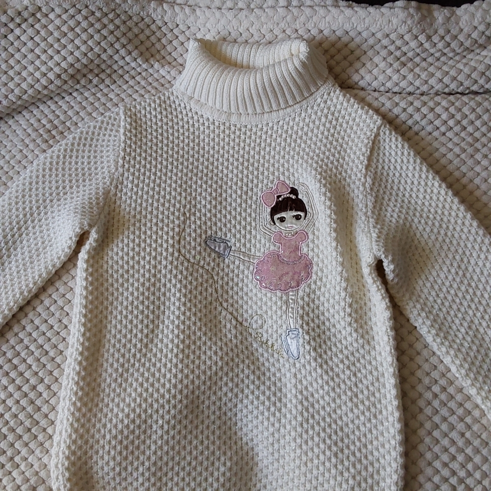 A ballerina neck sweater.